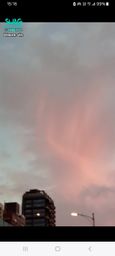 : Colorful rainbow lights hover in the sky.